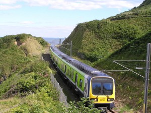800px-DART_train_approaching_Bray_from_Bray_Head_Wicklow_Ireland_2010